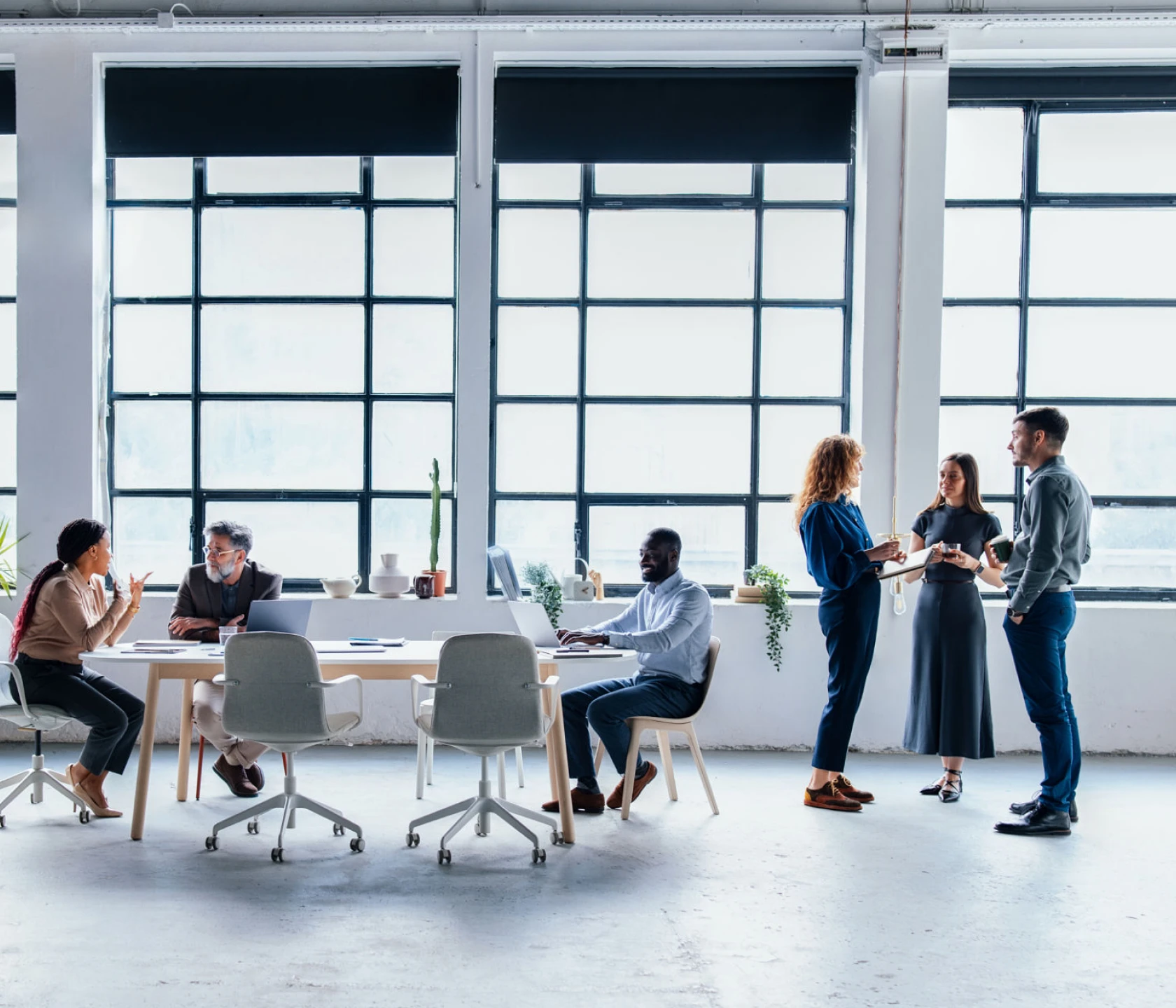 Open office with people working and talking.